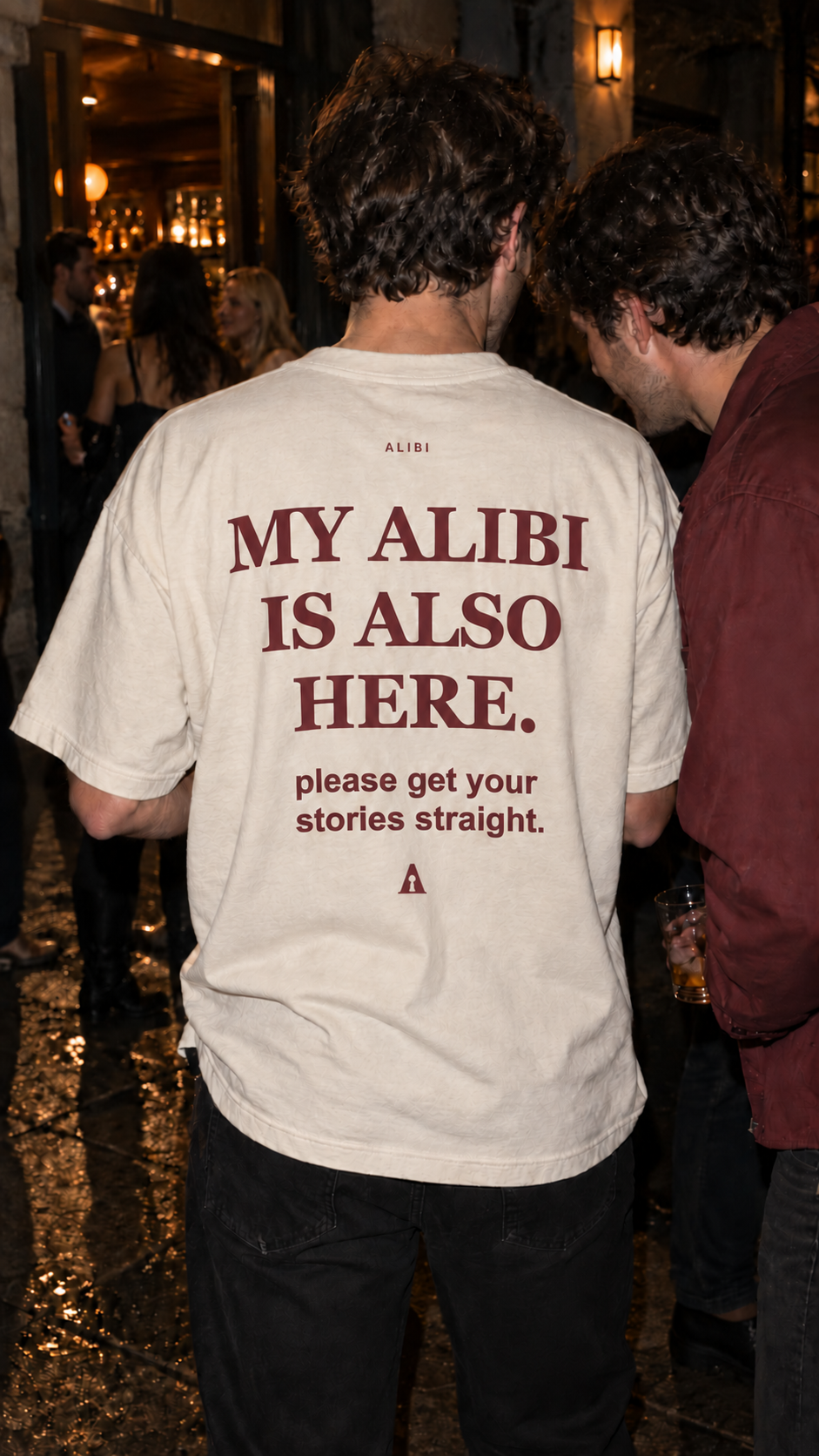 ALIBI tee with MY ALIBI IS ALSO HERE back print outside a bar