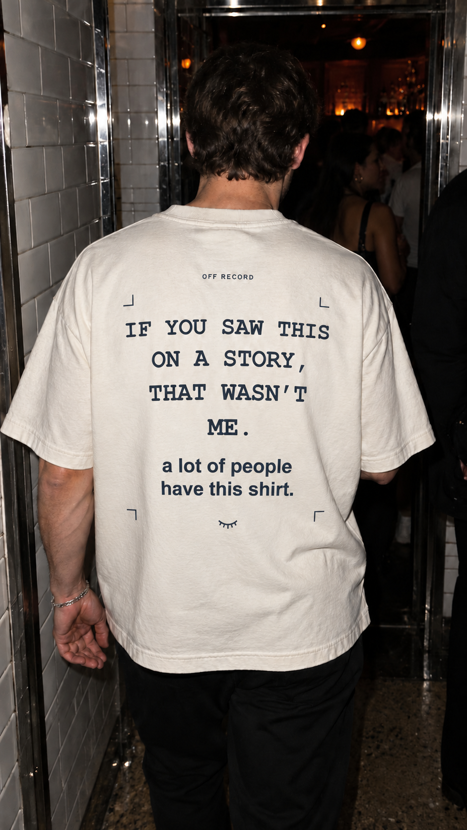 OFF RECORD tee with THAT WASN’T ME back print at an afterparty